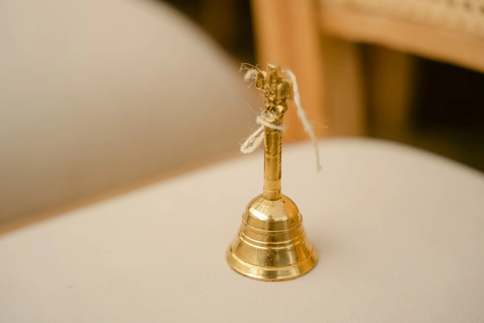 A small brass bell among the wedding details at Hyatt Regency Jaipur Mansarovar, Jaipur