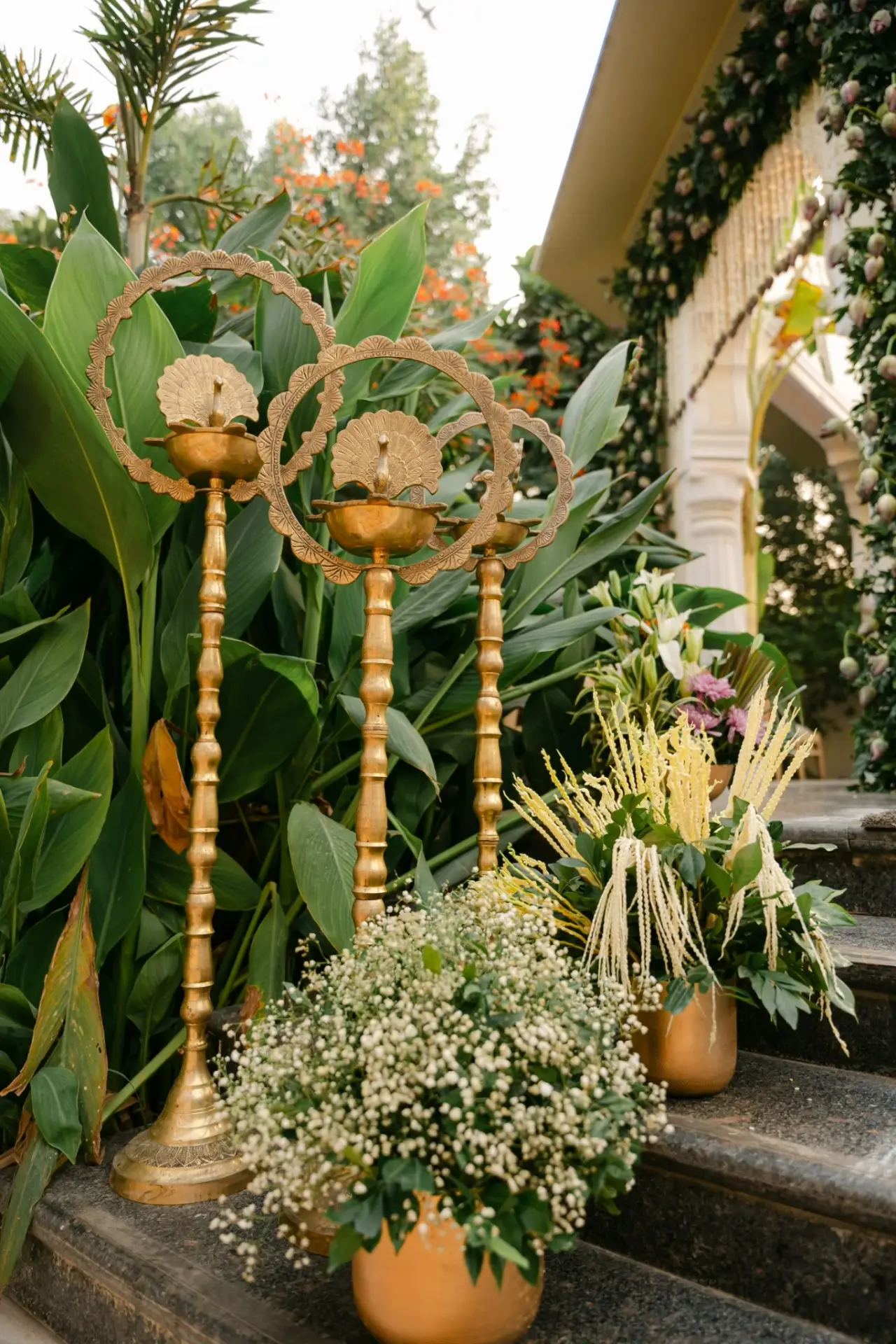Traditional brass lamp with white flowers and greenery at Hyatt Regency Jaipur Mansarovar, Jaipur