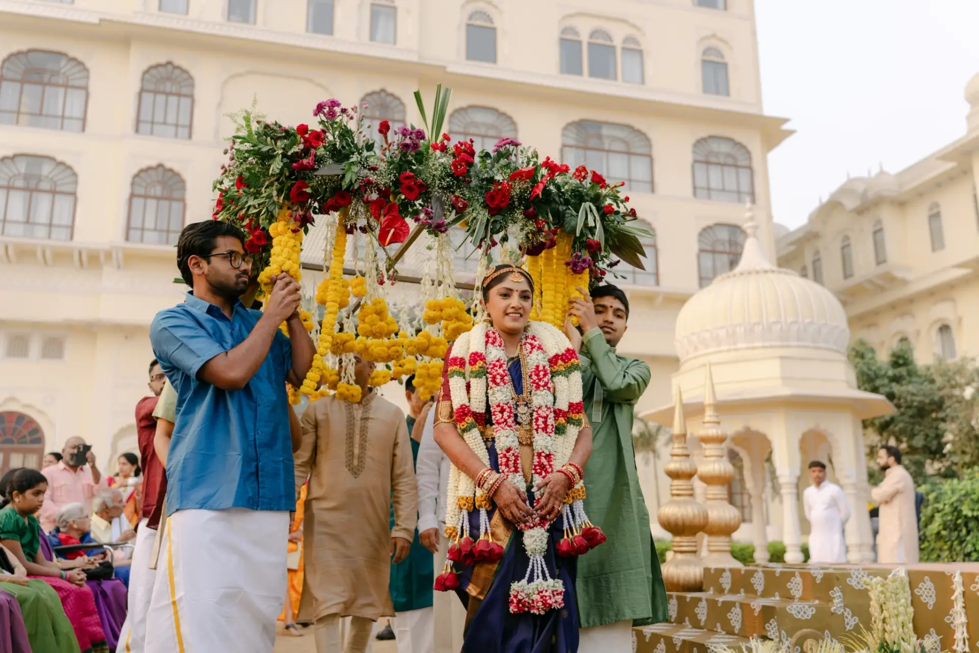Ankita entering beneath a floral chadar with family at Hyatt Regency Jaipur Mansarovar, Jaipur
