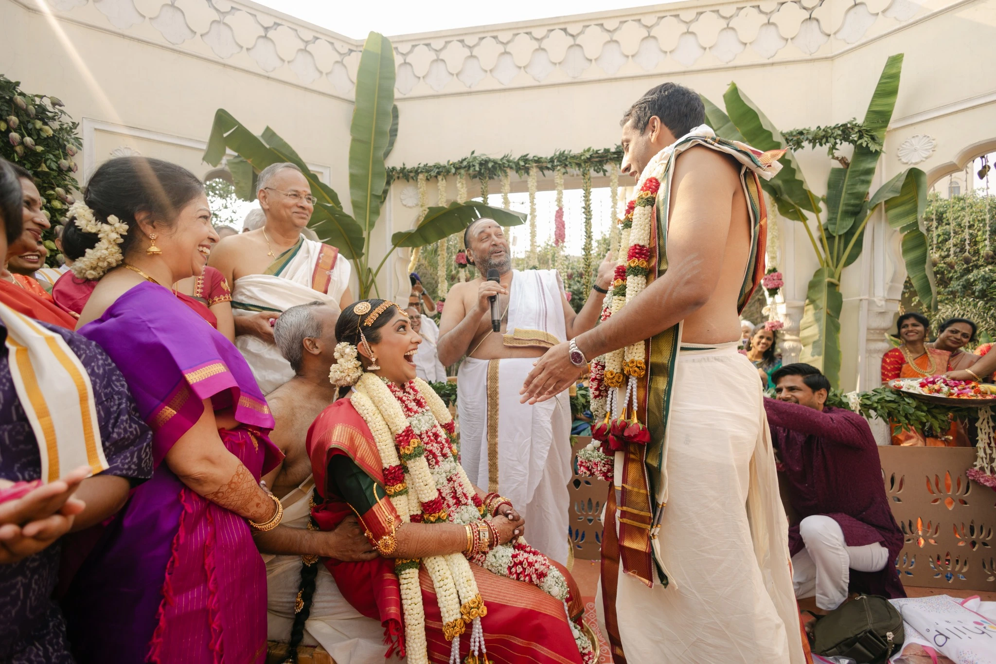 Family gathered around the couple during their Tamil wedding ceremony at Hyatt Regency Jaipur Mansarovar, Jaipur