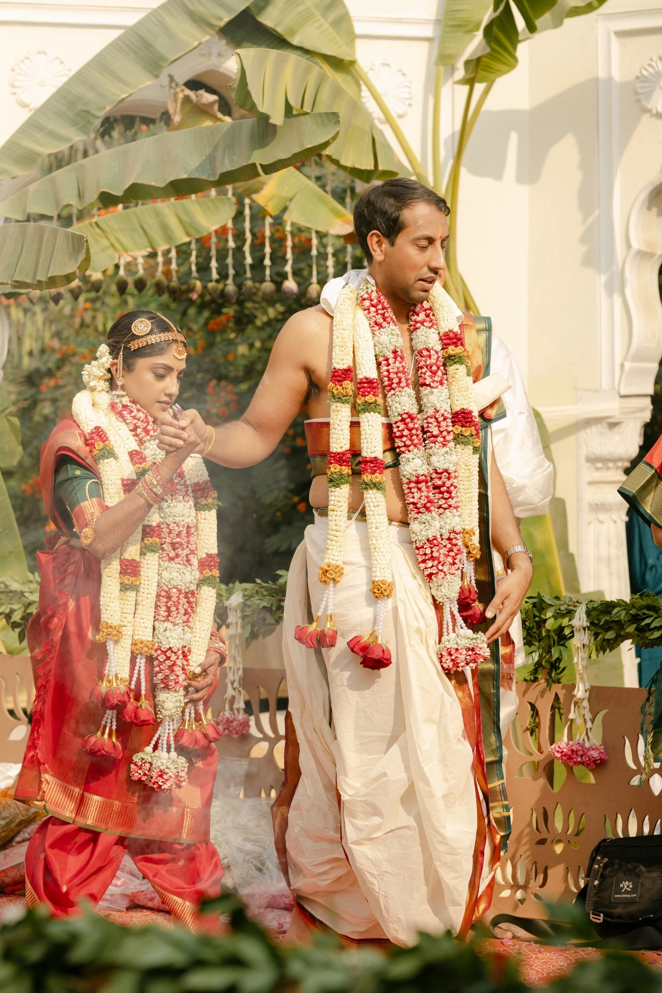 Ajay in traditional wedding attire with flower garlands at Hyatt Regency Jaipur Mansarovar, Jaipur