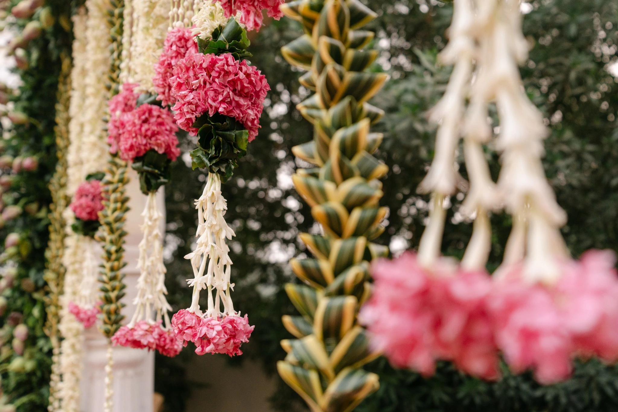 Close view of pink floral tassels and white flower strings at Hyatt Regency Jaipur Mansarovar, Jaipur