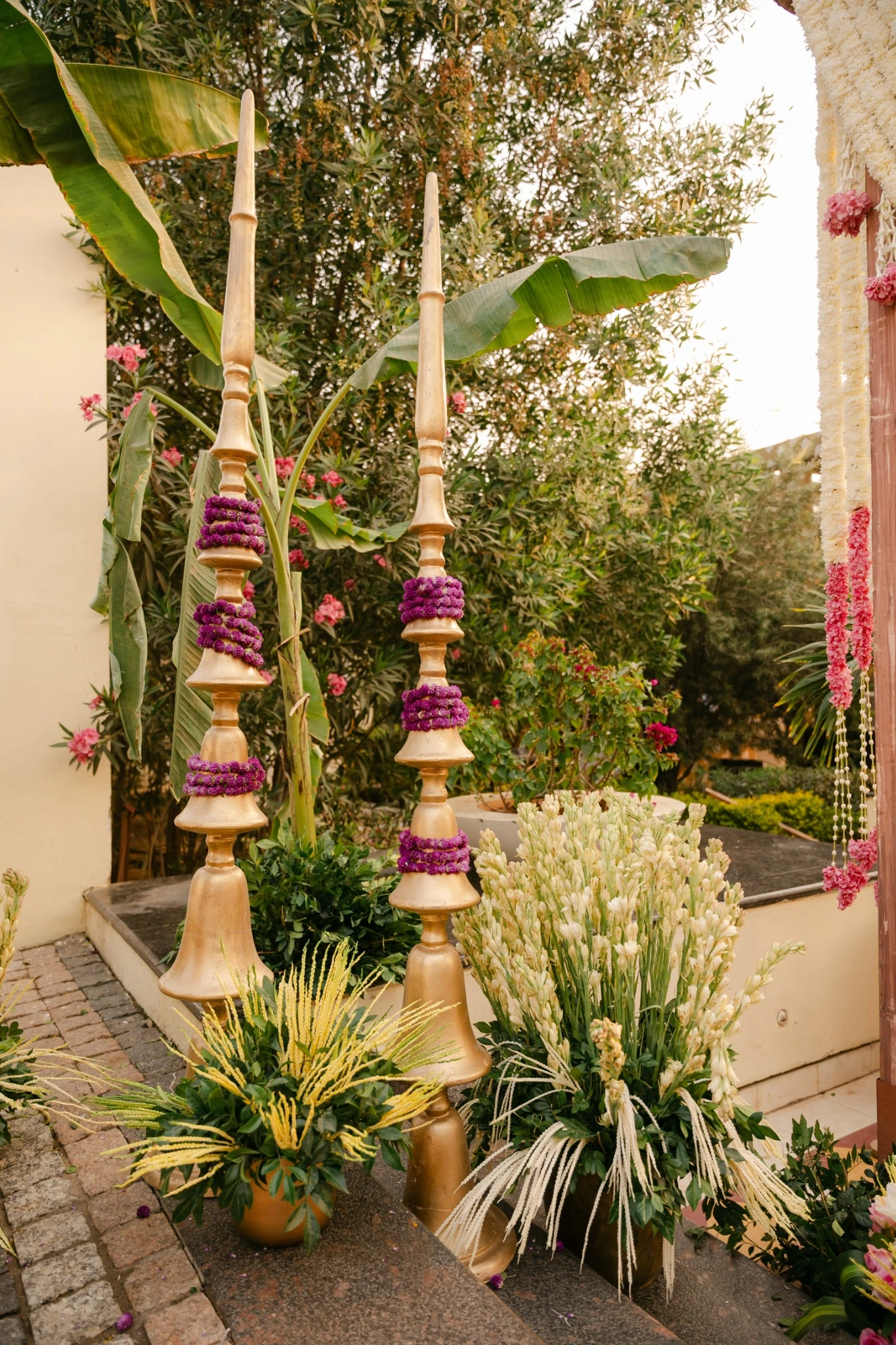 Decorated pillars, greenery and traditional sculptural details at Hyatt Regency Jaipur Mansarovar, Jaipur