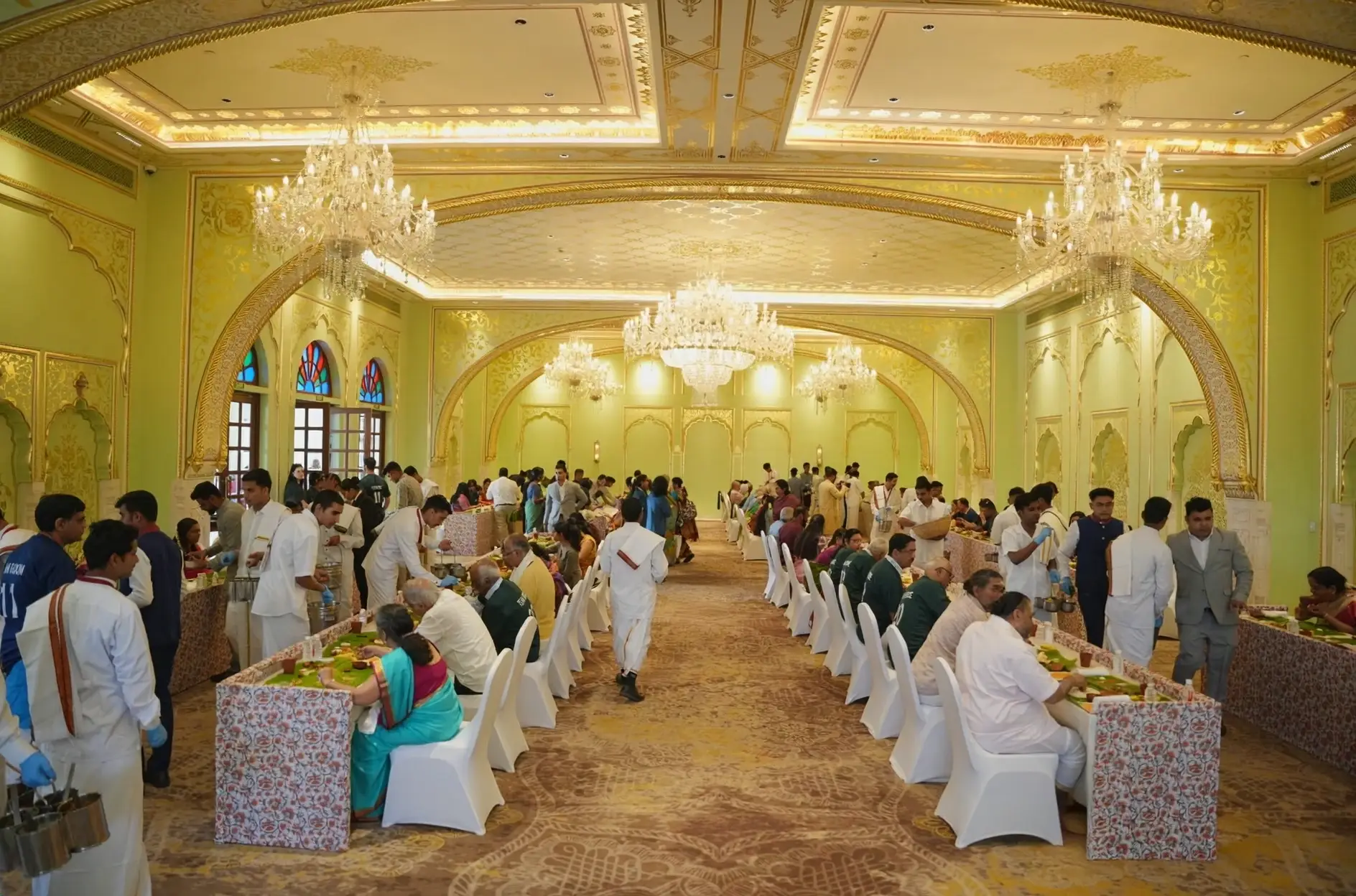 Guests gathered at dining tables for the wedding meal at Hyatt Regency Jaipur Mansarovar, Jaipur