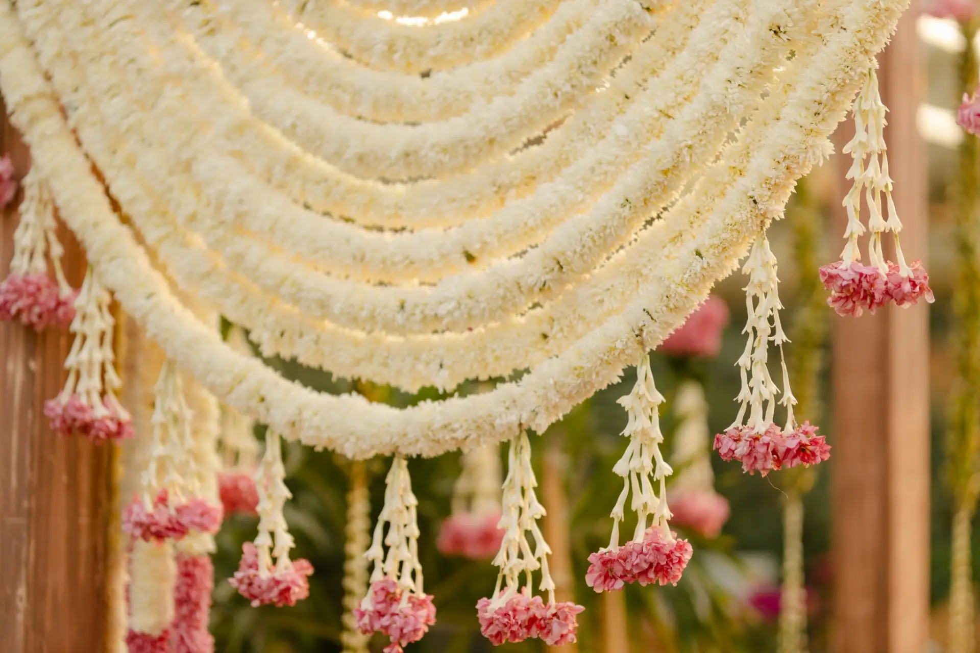 Layers of white flower garlands beneath the canopy at Hyatt Regency Jaipur Mansarovar, Jaipur