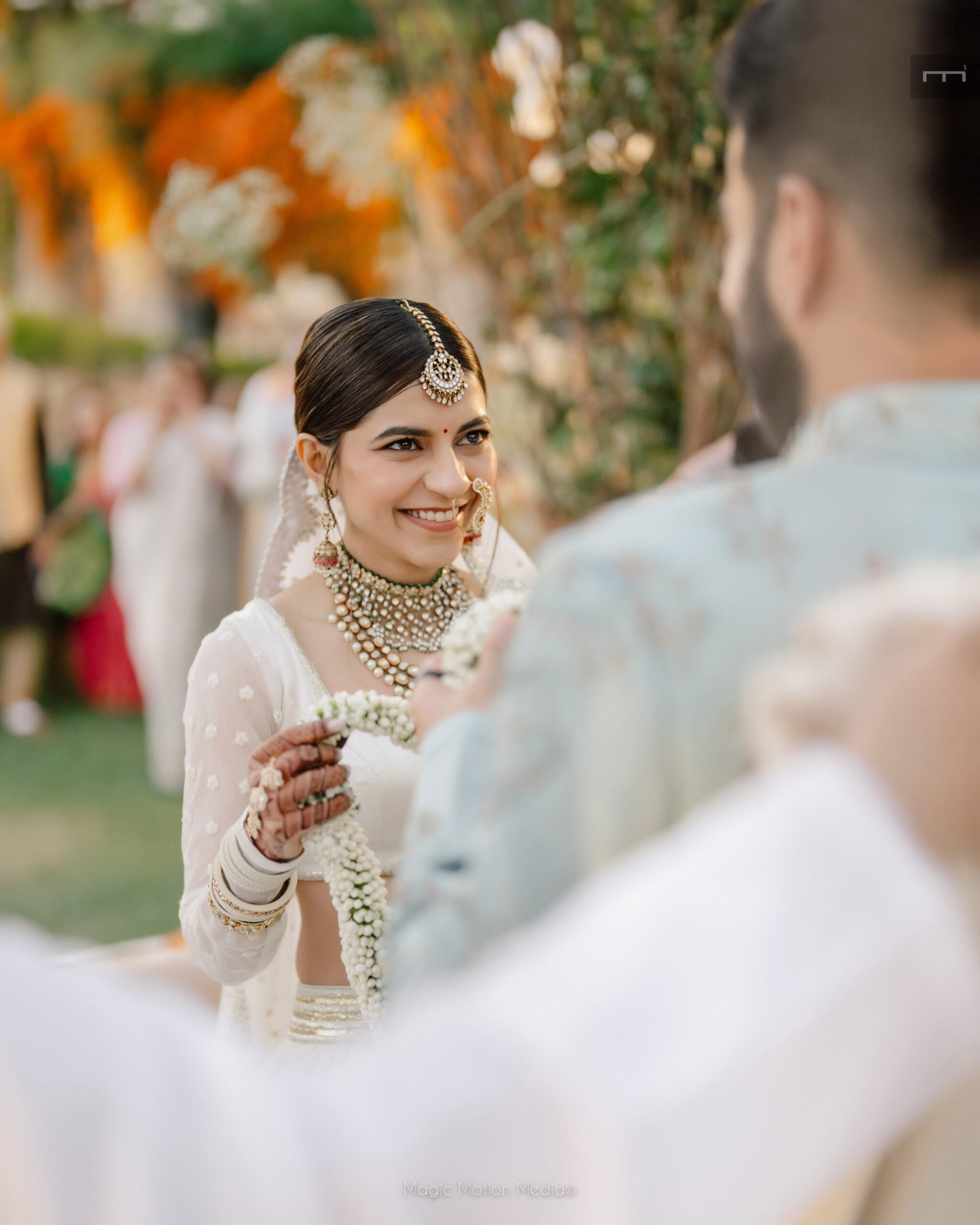 Bride smiling during her destination wedding ceremony at Alila Fort Bishangarh, Rajasthan.