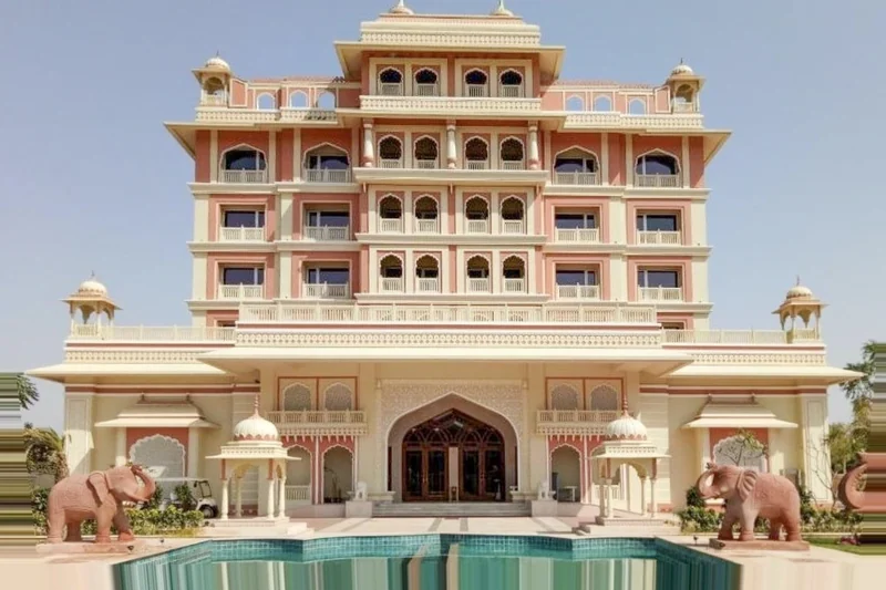 Frontal palace façade, entrance and pool at Indana Palace Jaipur.