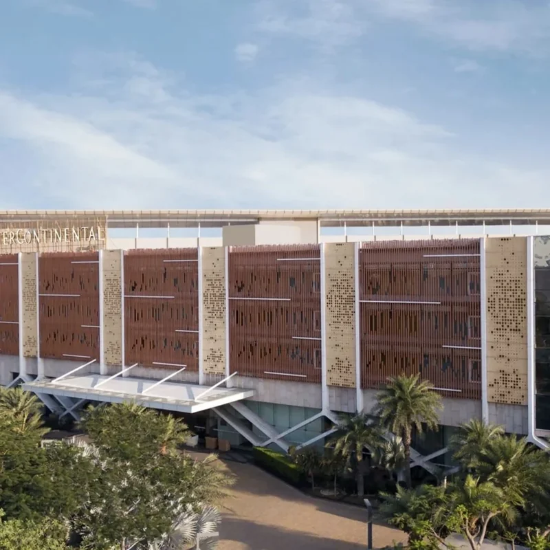Contemporary hotel façade and arrival canopy at InterContinental Jaipur Tonk Road.