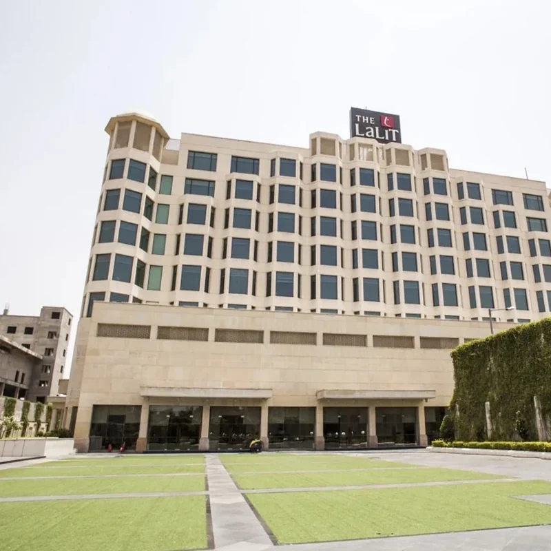 Modern hotel façade and landscaped forecourt at The LaLiT Jaipur.