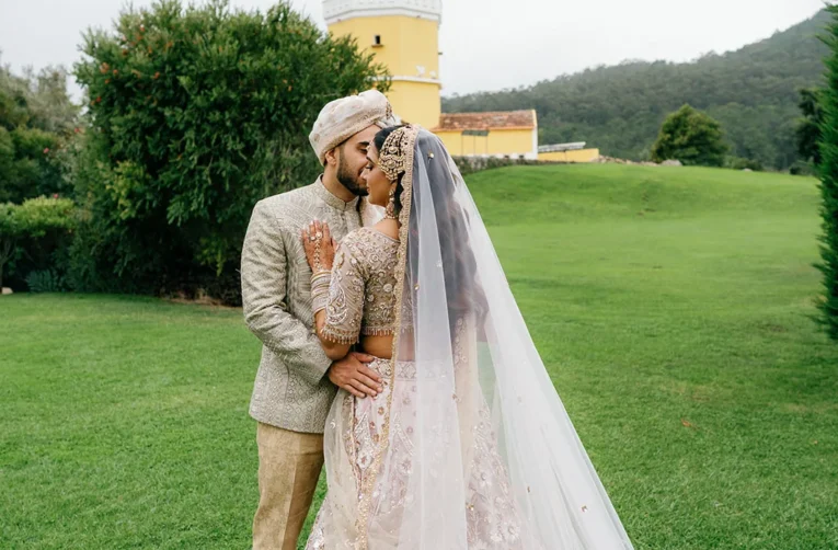 The couple together on the green grounds at Penha Longa Resort, Portugal