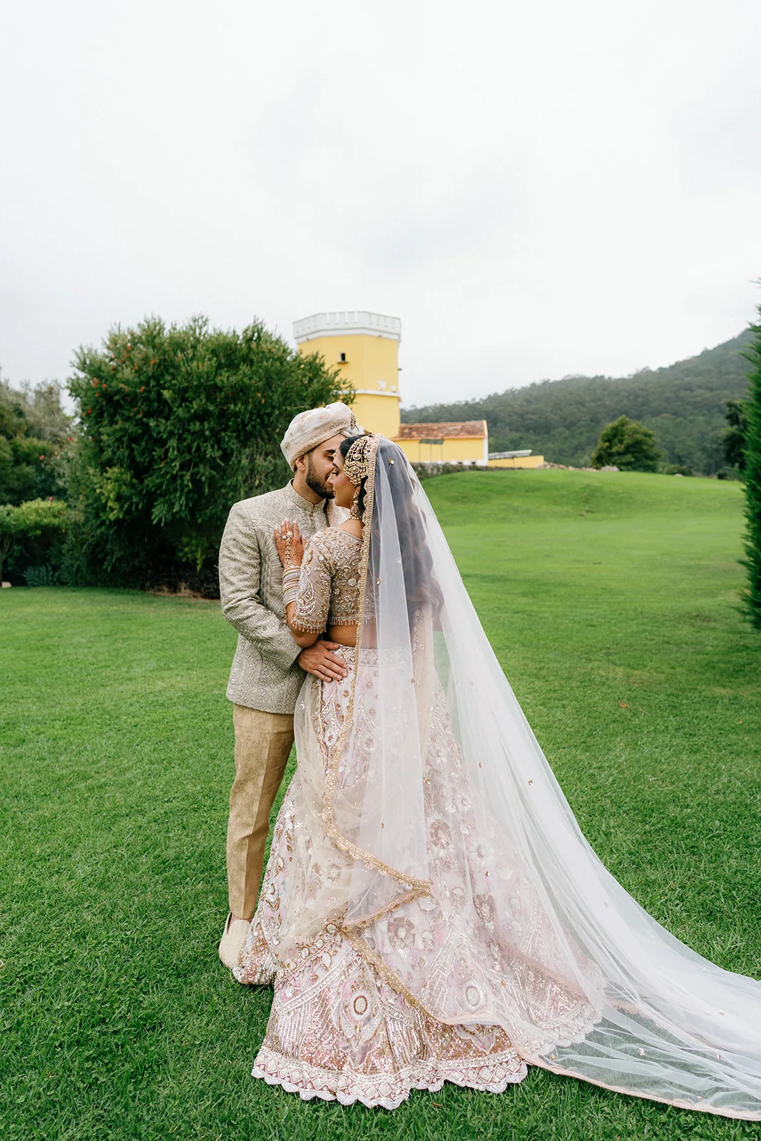 The couple together on the green grounds at Penha Longa Resort, Portugal