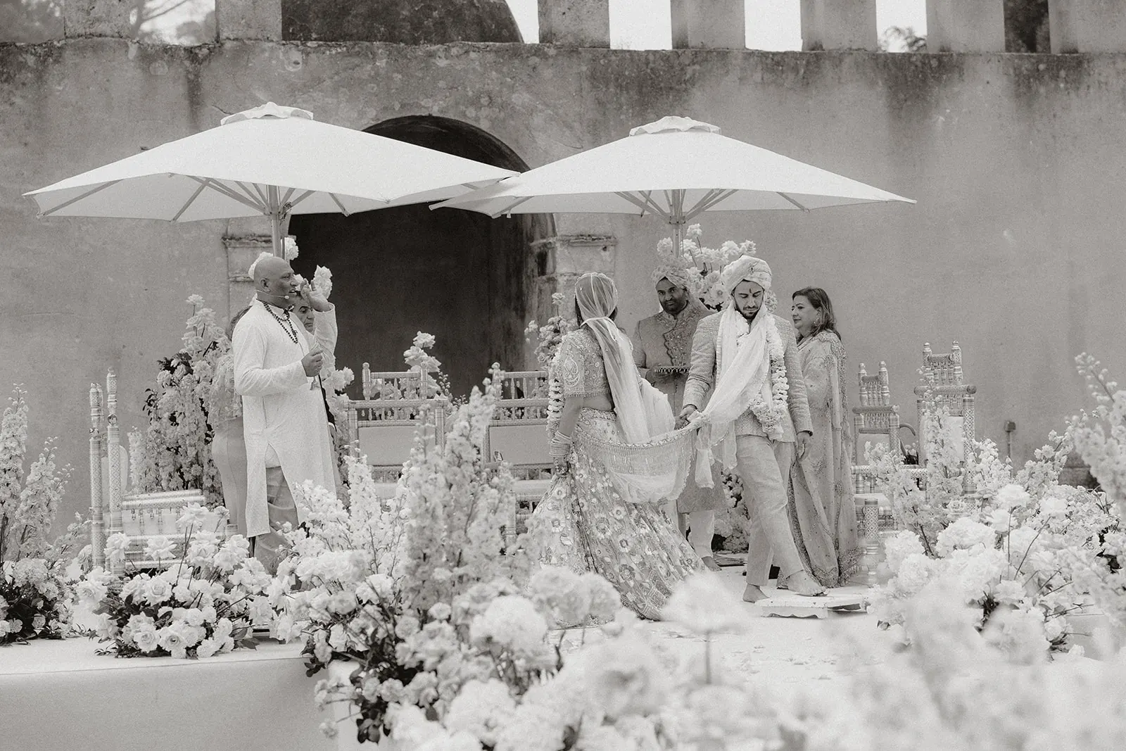 Bride and groom taking part in the wedding ceremony, photographed in black and white
