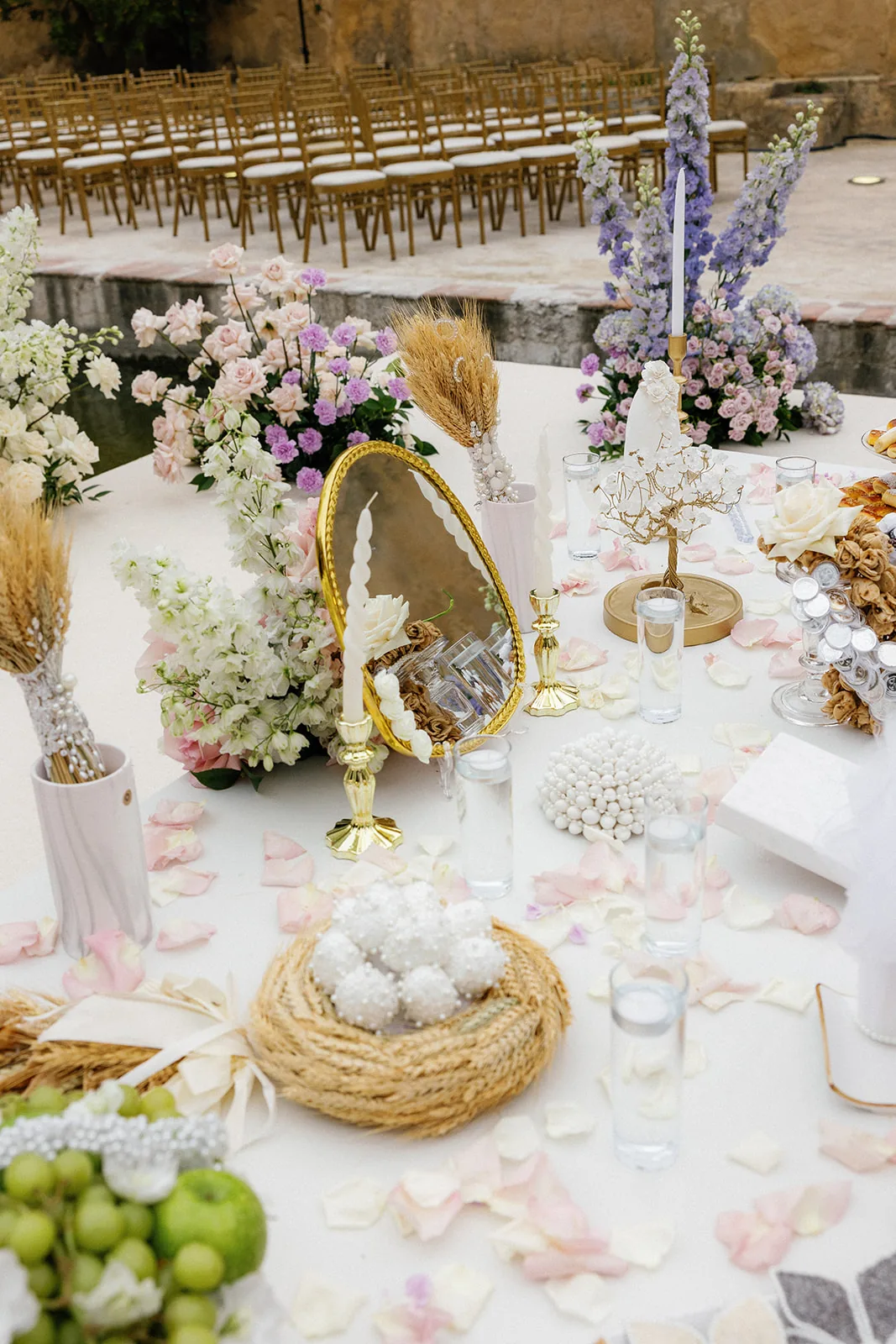 Wedding-day food and pastel floral styling around the ceremony setting