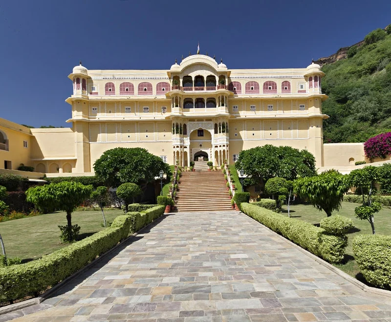 Centered daylight front façade, staircase and garden at Samode Palace.